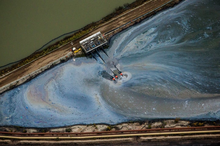 Aerial view of operations at the Athabasca oil sands near Fort McMurray, Alberta, Canada. Tar sands extraction causes significant climate and environmental damage.