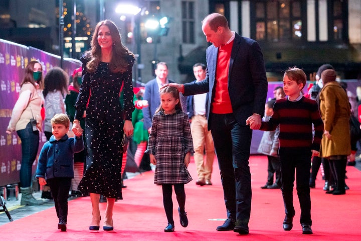 Prince William, Duke of Cambridge, his wife Britain's Catherine, Duchess of Cambridge, and their children Britain's Prince George of Cambridge (R), Britain's Princess Charlotte of Cambridge (3rd L) and Britain's Prince Louis of Cambridge (L) arrive to attend a special pantomime performance of The National Lotterys Pantoland at London's Palladium Theatre in London on December 11, 2020, to thank key workers and their families for their efforts throughout the pandemic. (Photo by Aaron Chown / POOL / AFP) (Photo by AARON CHOWN/POOL/AFP via Getty Images)