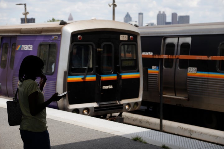 In this Tuesday, Aug. 20, 2019, photo, a woman waits to board a Metropolitan Atlanta Rapid Transit Authority train at West En