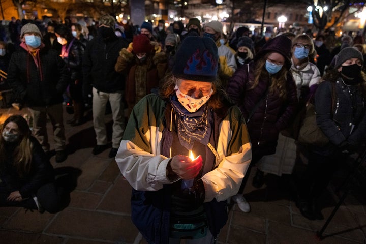Boulder residents attend a candle light vigil honoring the 10 people who were killed on March 24, 2021 in Boulder, Colorado.