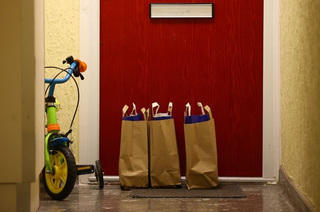 Bags containing meals for school children on the doorstep of an apartment in a block of flats in Twickenham.