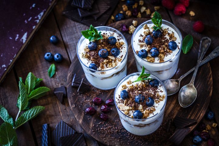 Greek yogurt topped with fruits and nuts is a simple, high-protein breakfast. 