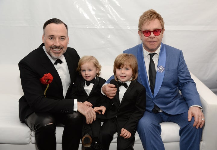 David Furnish, Elijah Furnish-John, Zachary Furnish-John, and Sir Elton John attend the 23rd Annual Elton John AIDS Foundation Academy Awards Viewing Party on February 22, 2015, in Los Angeles, California.