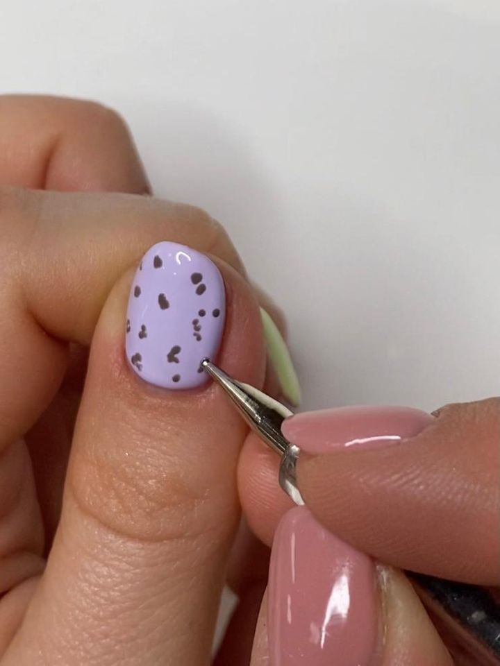 Use a dotting tool or toothpick to add the speckled effect.