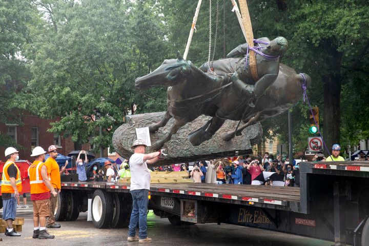 A statue of Confederate Gen. Stonewall Jackson is loaded on a truck after being removed from Monument Avenue in Richmond, Vir