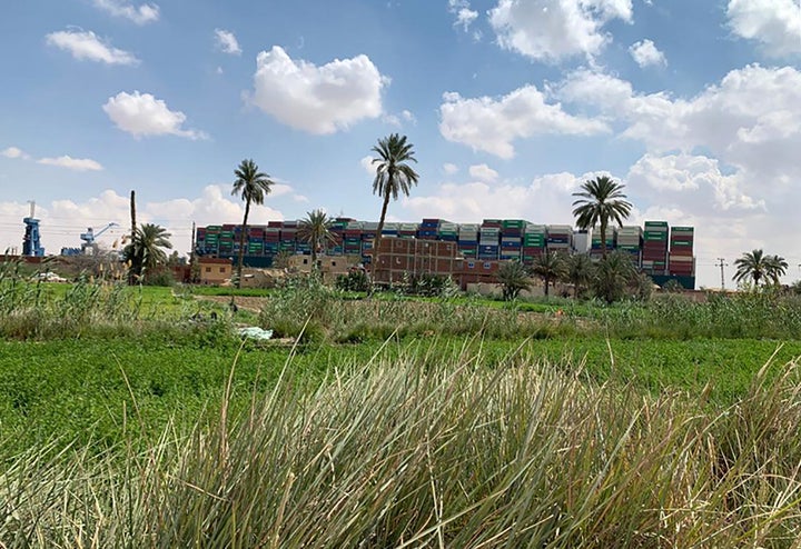 The Ever Given container ship is lodged sideways and impeding all traffic across the waterway of Egypt's Suez Canal, on March