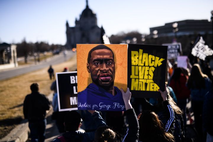 People march near the Minnesota State Capitol to honor George Floyd on March 19 in St. Paul, Minnesota. (Photo by Stephen Mat