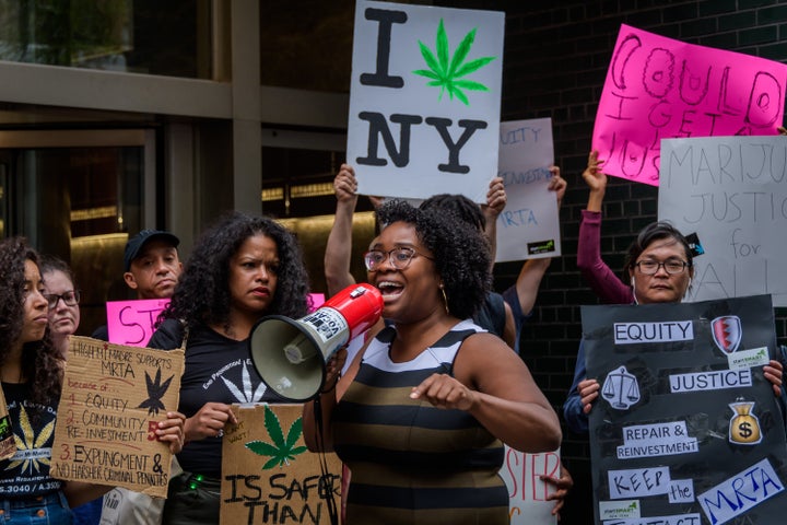 People are seen demonstrating in 2019 outside the New York governor's office in Manhattan in support of regulating marijuana.