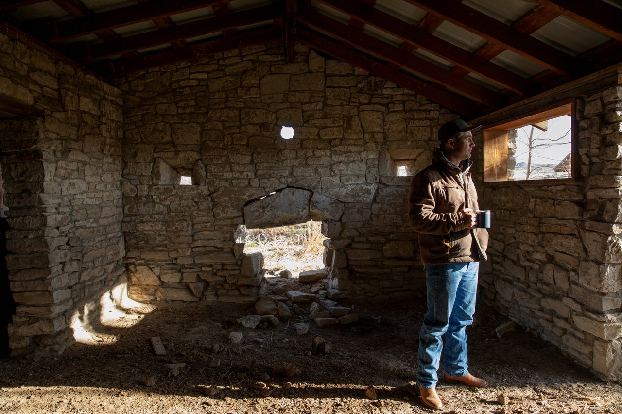 Elias Eiguren walks through a historic fort building that stands on the family's property near Arock, Oregon, on March 27.