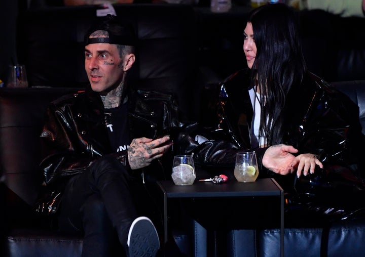 Travis Barker and Kourtney Kardashian are seen in attendance during the UFC 260 event at UFC APEX on March 27.