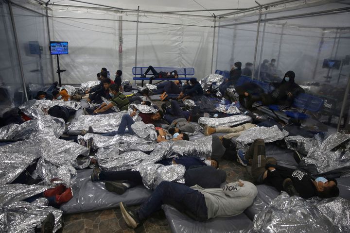 Young children rest inside a pod at the Donna Department of Homeland Security holding facility, the main detention center for unaccompanied children in the Rio Grande Valley run by the Customs and Border Patrol, in Donna, Texas on March 30, 2021.
