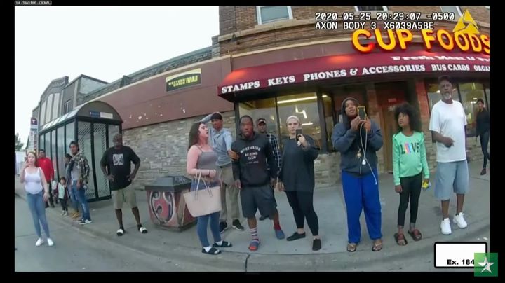 In this still image from the night of George Floyd's arrest, Alyssa Funari can be seen on the far left in white, Kaylynn Gilb
