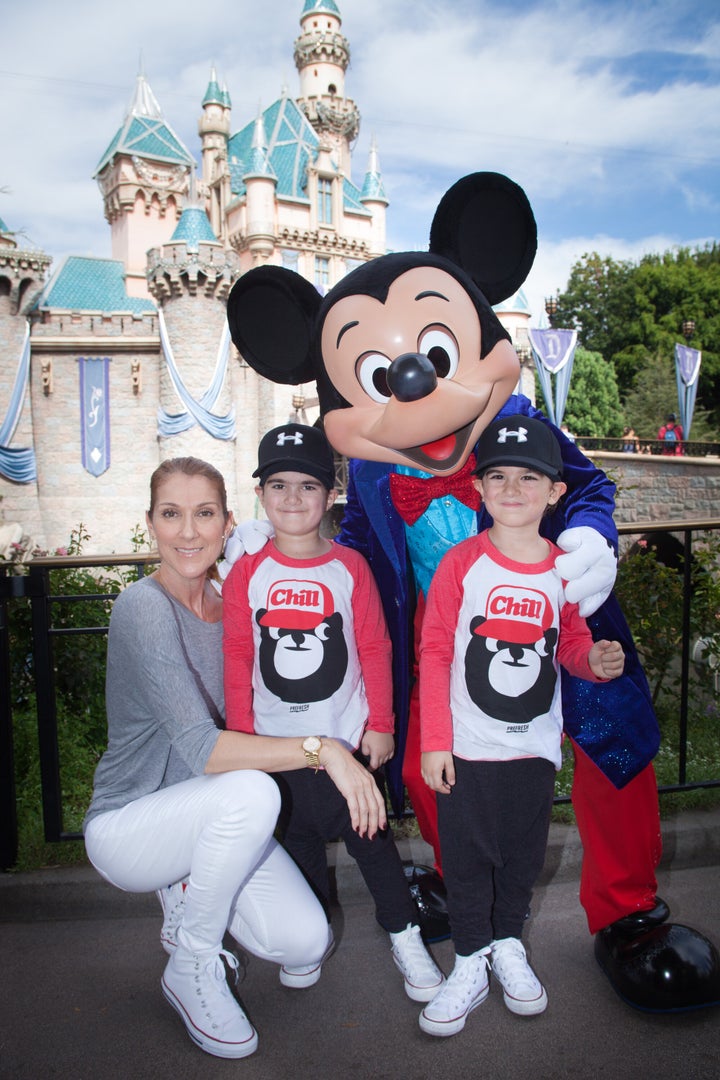 Celine Dion and twin sons Eddy and Nelson celebrate the boys' fifth birthday with Mickey Mouse at Disneyland in Anaheim, California, in October 2015.