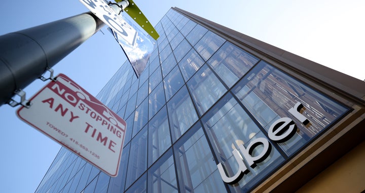 A sign is posted at Uber's new headquarters in San Francisco on Monday. Uber's drivers have been able to collect unemployment during the pandemic.