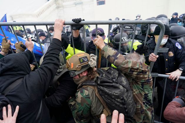 <strong>Police try to hold back protesters attempting to halt a joint session of the 117th Congress in Washington on January 6</strong>” data-caption=”<strong>Police try to hold back protesters attempting to halt a joint session of the 117th Congress in Washington on January 6</strong>” data-rich-caption=”<strong>Police try to hold back protesters attempting to halt a joint session of the 117th Congress in Washington on January 6</strong>” data-credit=”Kent Nishimura via Getty Images” data-credit-link-back=”” /></p>
<div class=