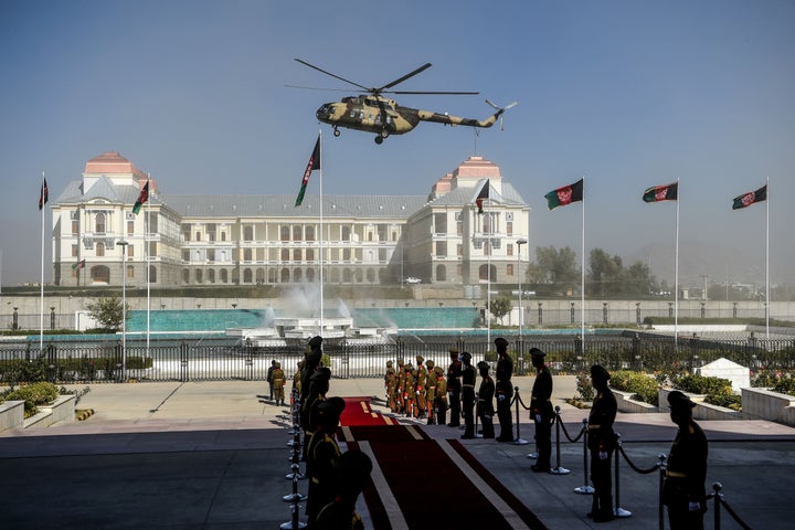 An Afghan Air Force helicopter flies over ahead of the arrival of Afghanistan's President Ashraf Ghani for the introduction of ministerial nominees at the Parliament in Kabul on Oct. 21, 2020.