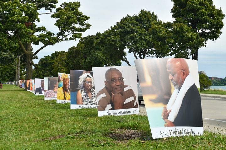 Images of COVID-19 victims from Detroit are displayed in a drive-by memorial at Belle Isle State Park on Sept. 2, 2020 in Detroit, Michigan. 