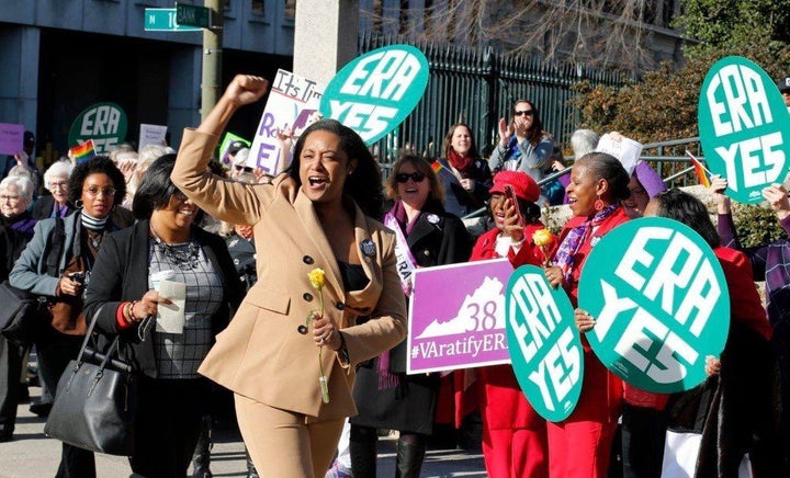 Jennifer Carroll Foy, center, cheers on supporters of the Equal Rights Amendment. Carroll Foy is one of two Virginia candidat