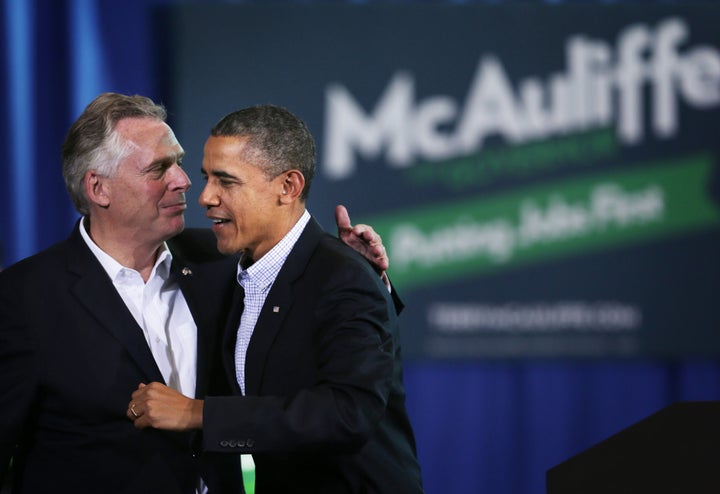 Terry McAuliffe greets then-President Barack Obama at a rally for McAuliffe's first gubernatorial bid. Obama's support was critical to McAuliffe's first win.