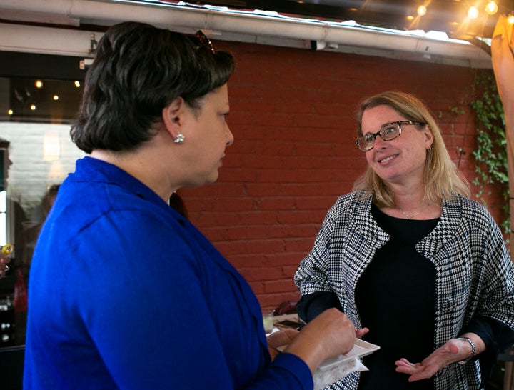 Virginia state Sen. Jennifer McClellan (D), left, campaigns for a state House candidate in 2019. McClellan has represented th