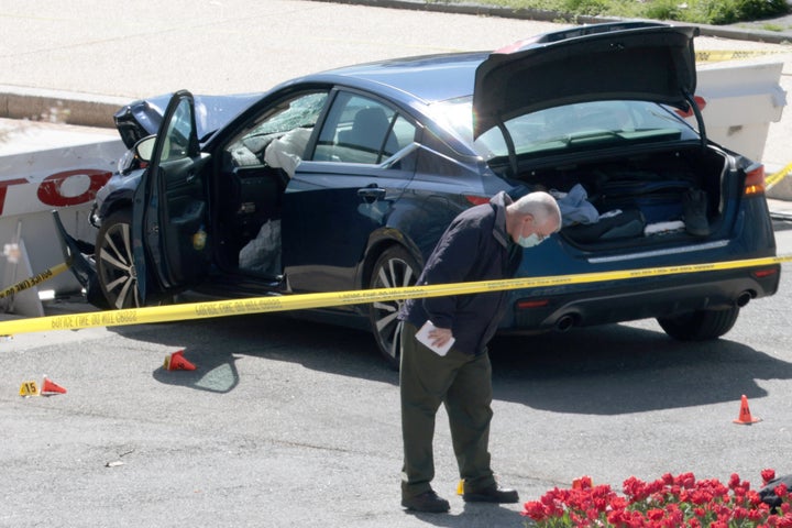 Law enforcement investigate the scene after a vehicle charged a barricade at the US Capitol.