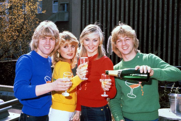 Band members Mike Nolan, Jay Aston, Cheryl Baker, and Bobby G celebrate their Eurovision victory