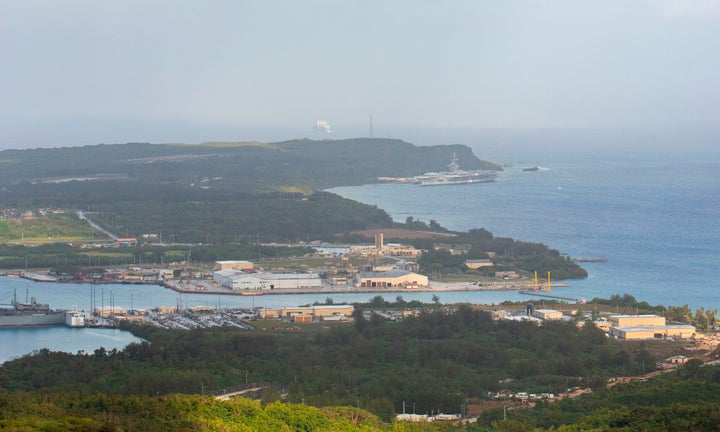 The aircraft carrier Theodore Roosevelt (upper right) is docked at Naval Base Guam in Apra Harbor on April 27, 2020. Guam has