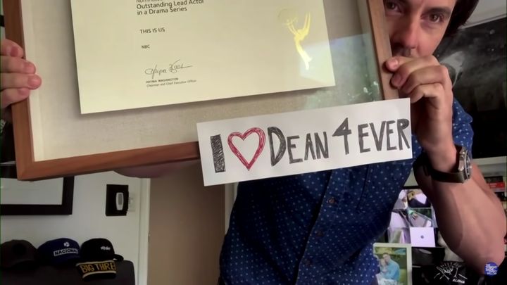 Milo Ventimiglia shows off his “I Love Dean 4 Ever” sign.