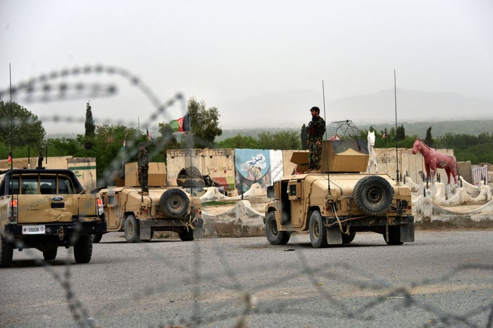 Afghan security forces stand on Humvees during a military operation in the Arghandab district of Kandahar province on April 4, 2021.