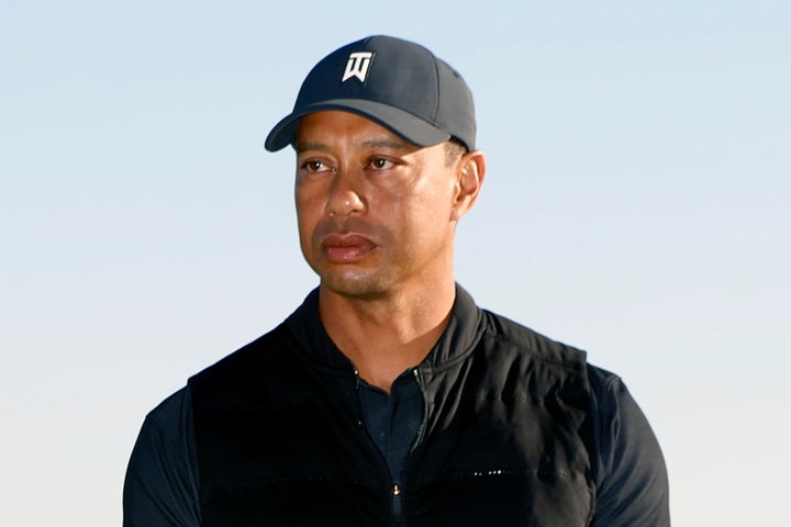 In this Feb. 21, 2021, file photo, Tiger Woods looks on during the trophy ceremony on the practice green after the final roun