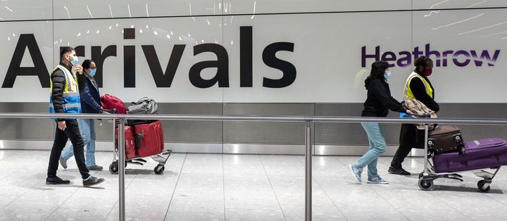 Passengers travelling from one of the countries on the "red list" are escorted through Heathrow airport.