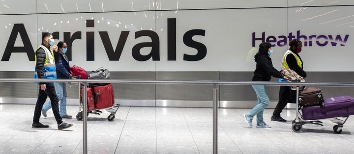 Passengers travelling from one of the countries on the "red list" are escorted through Heathrow airport.