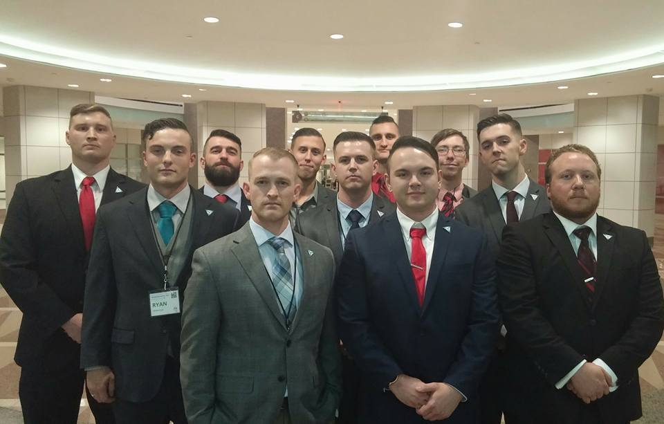 Shawn McCaffrey, in the front row wearing a red tie, poses for a photo with fellow members of the white nationalist group Ide