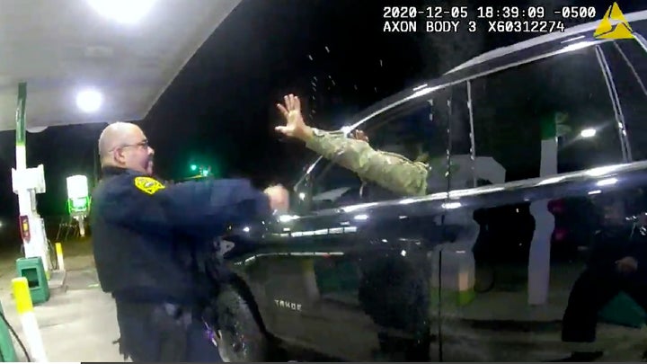 In this image made from Windsor, (Va.) Police video, a police officer uses a spray agent on Caron Nazario on Dec. 20, 2020, i