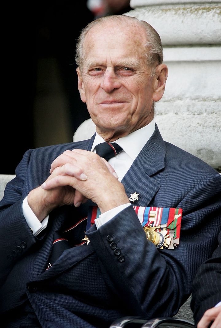 The Duke of Edinburgh watches the Gurka band march past as World War II veterans gather to commemorate the 60th anniversary a