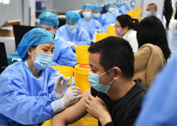 CHONGQING, April 8, 2021 -- People receive COVID-19 vaccination at a temporary vaccination site in Jiangbei District of Chongqing, southwest China, April 8, 2021. A new temporary vaccination site opened on Thursday in Jiangbei District of Chongqing, with daily inoculation capacity of about 2,000 doses. (Photo by Wang Quanchao/Xinhua via Getty) (Xinhua/Wang Quanchao via Getty Images)