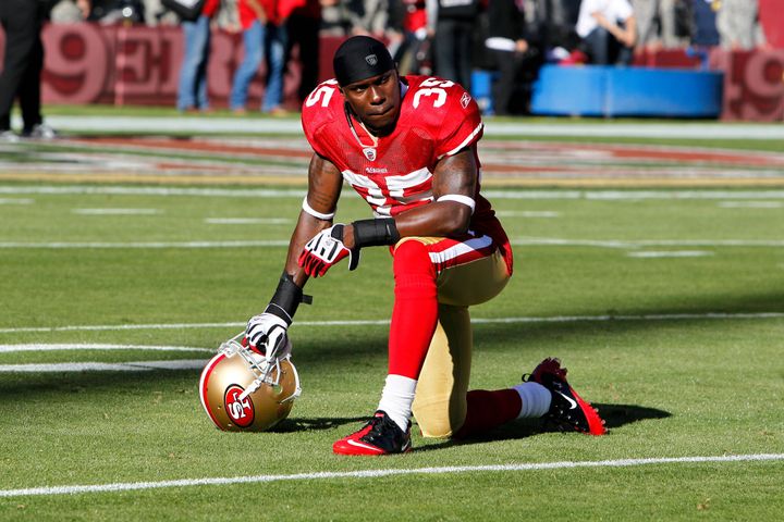 In this 2010 file photo, Philip Adams, then a cornerback for the San Francisco 49es, can be seen kneeling on the field at Candlestick Park in San Francisco.