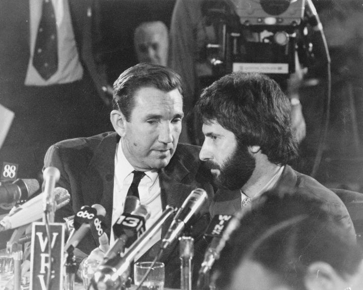 New York City police officer Frank Serpico sits with his attorney, former US Attorney General Ramsey Clark, during a press co