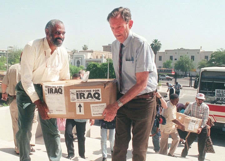 Former US attorney general Ramsey Clark is carrying boxes full of medicines in Baghdad. Clark arrived a day earlier with a multi-million-dollar shipment of humanitarian aid for Iraqi people suffering under almost eight years of UN sanctions.