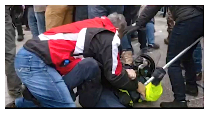 Evidence photo of Thomas Webster and a police officer at the Capitol riot.