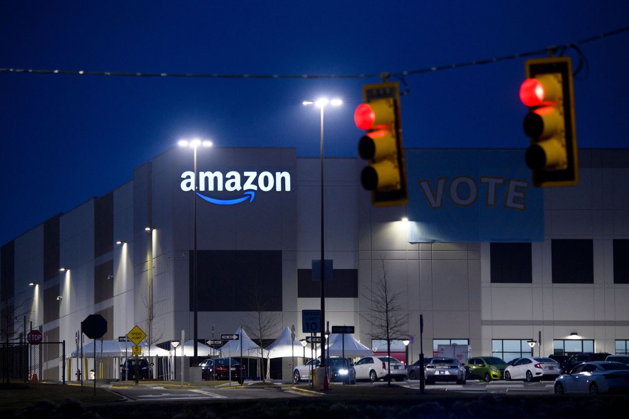 A “Vote” banner hangs at Amazon’s Bessemer, Alabama, warehouse during the union election. Workers ended up voting 1,798 to 738 against unionizing.
