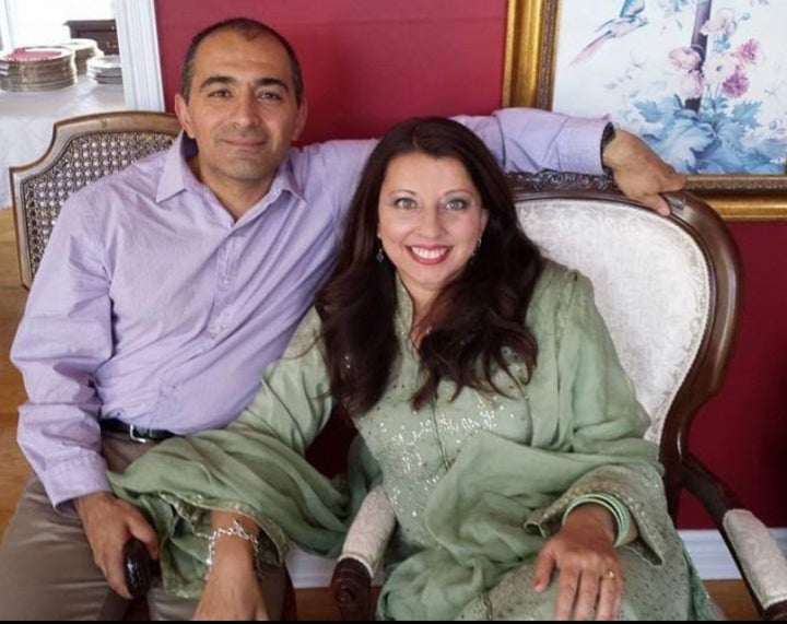 Ausma Khan, an author based in Denver, with her husband during a pre-pandemic Eid, an Islamic holiday after the month of Ramadan.