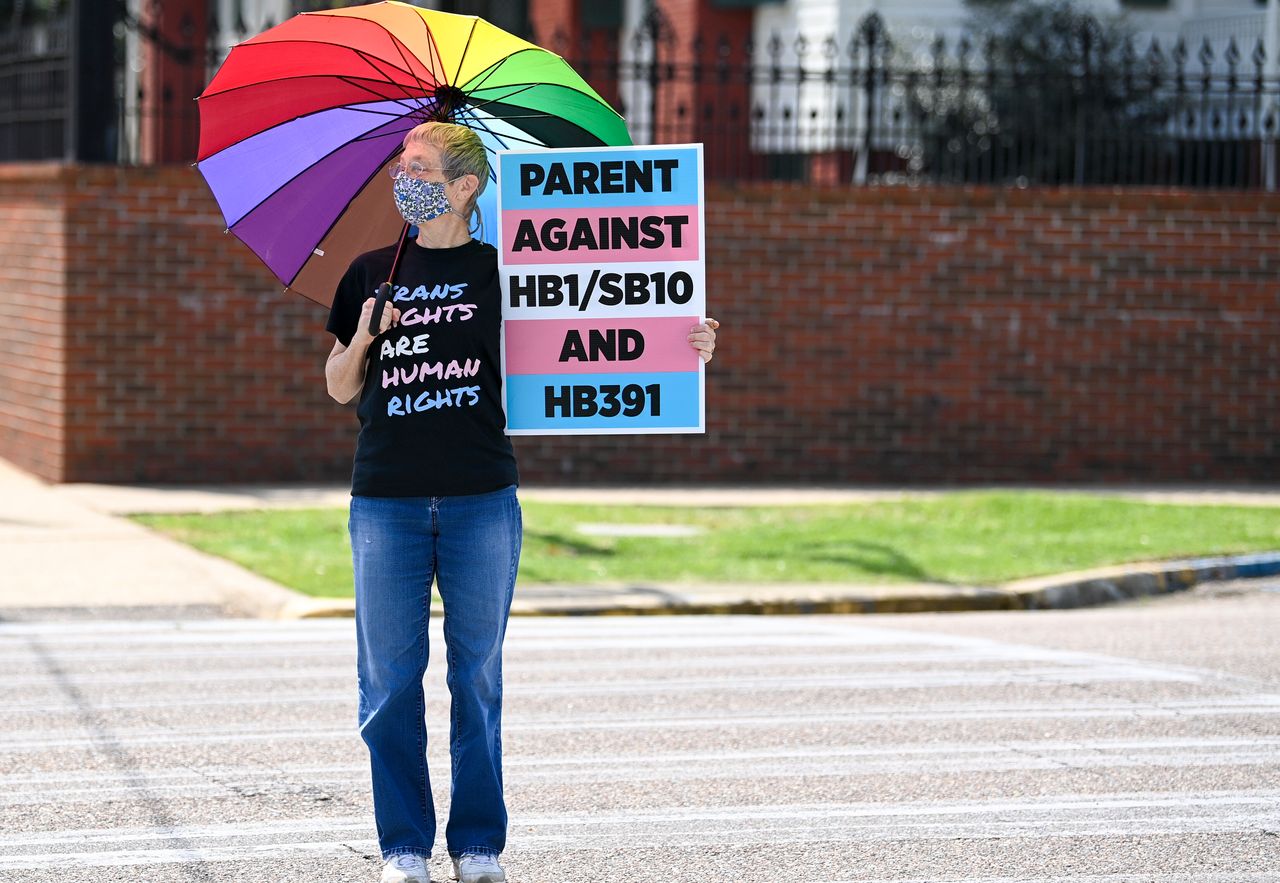 Jan Newton crosses the street to attend a March 30 rally at the Alabama State House in Montgomery to draw attention to anti-transgender legislation.