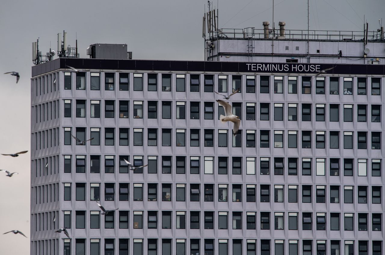 Terminus House, a disused office building now being used for social housing, has come under some criticism for its "human warehouse" conditions. 
