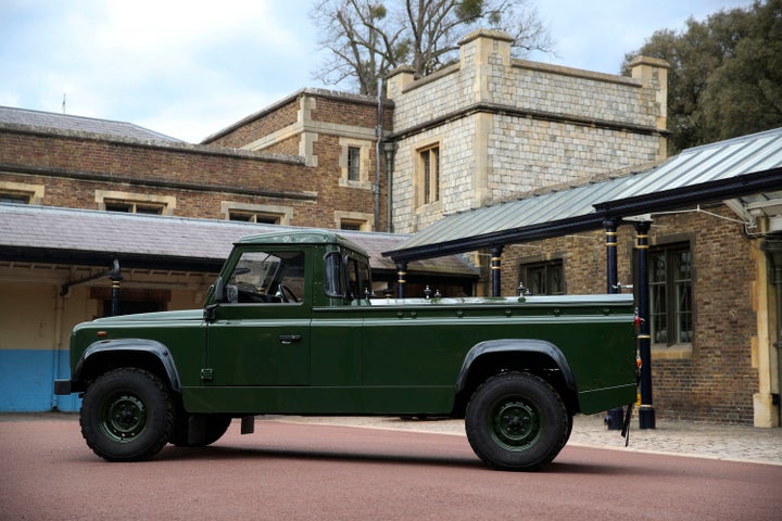 WINDSOR, ENGLAND - APRIL 15: The Jaguar Land Rover that will be used to transport the coffin of Prince Philip, Duke of Edinburgh, at his funeral on Saturday, is displayed at Windsor Castle, on April 15, 2021 in Windsor, England. The modified Land Rover Defender TD5 130 chassis cab vehicle was made at Land Rover's factory in Solihull in 2003 and Philip oversaw the modifications throughout the intervening years, requesting a repaint in military green and designing the open top rear and special "stops" to secure his coffin in place. The Duke of Edinburgh's funeral will be held at Windsor Castle on Saturday, April 17, following his death at the age of 99 on April 10. (Photo by Steve Parsons - WPA Pool/Getty Images)