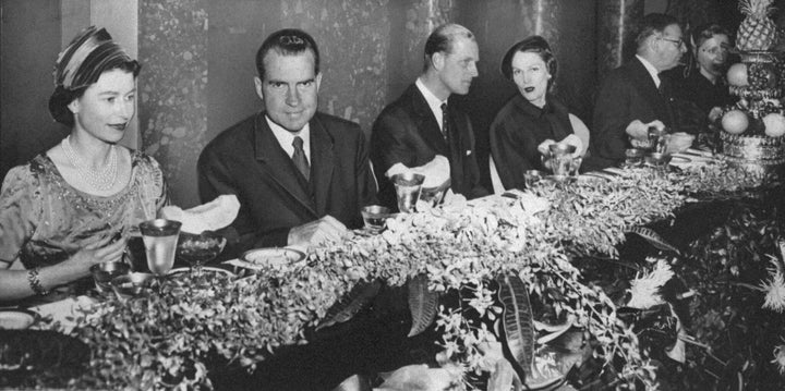 Queen Elizabeth, Vice President Richard Nixon, Prince Philip and Mrs. Pat Nixon, (l. to r.), seated at a table in Old Supreme Court Chamber. 