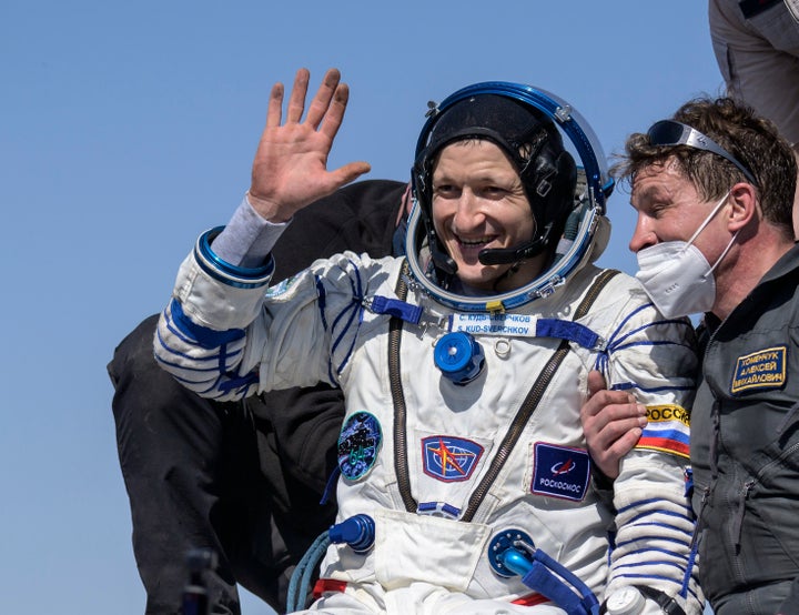 In this photo provided by NASA, Roscosmos cosmonaut Sergey Kud-Sverchkov is helped out of the Soyuz MS-17 spacecraft.