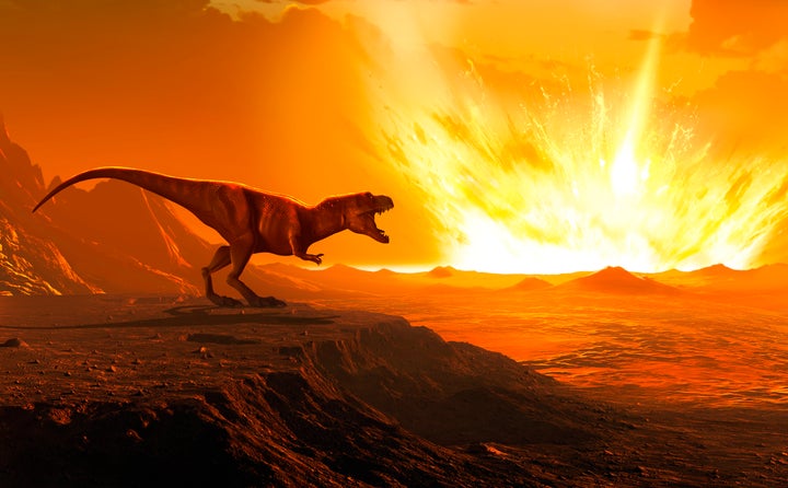 Illustration of a Tyrannosaurus as an asteroid strikes the earth.