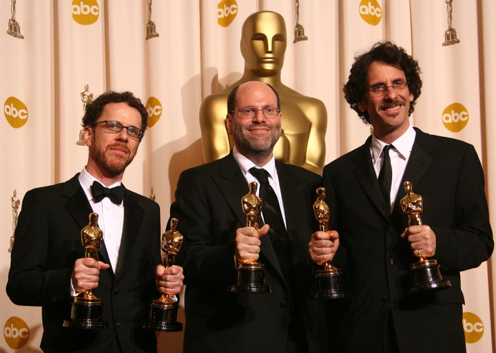 Producers Ethan Coen, Scott Rudin and Joel Coen pose in the press room during the 80th annual Academy Awards at the Kodak The