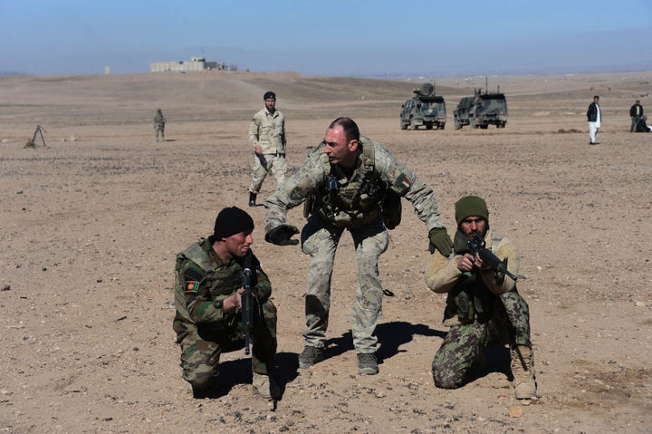 An Italian soldier (center) trains Afghan military personnel in 2017.